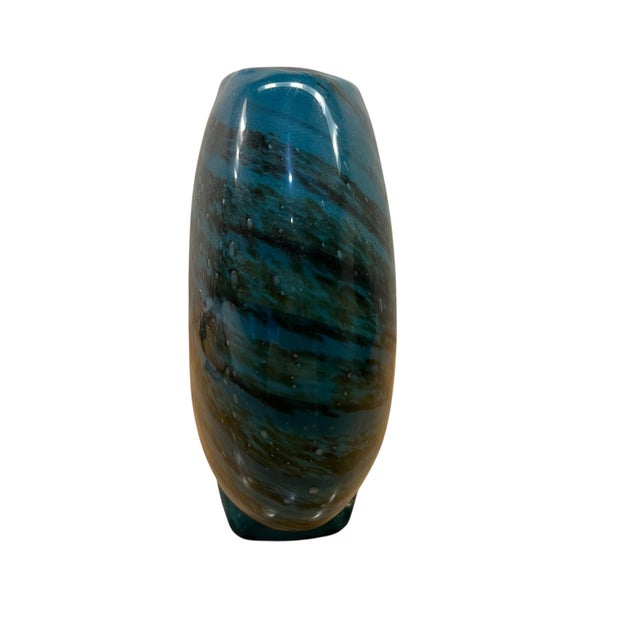 Elevate your space with this stunning, heavy hand-blown art glass vase. The piece boasts a beautiful rounded, spherical...