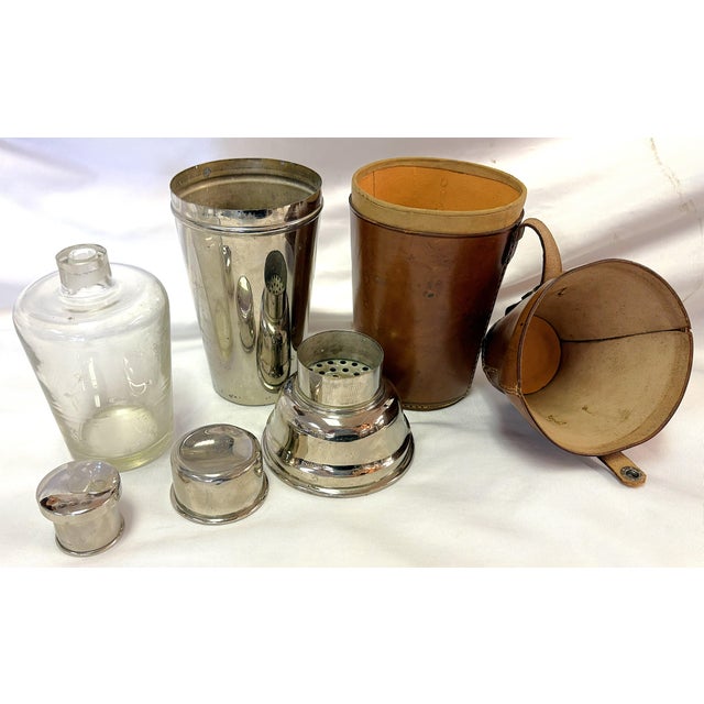 Wonderful vintage nesting cocktail shaker set from the 1930's. The set includes a leather case with a snap closure which...