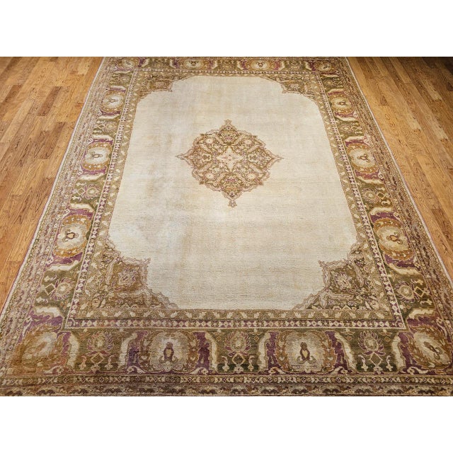 An elegant and serene 19th century room-size Indian Amritsar rug, handwoven in Northern India and distinguished by its...