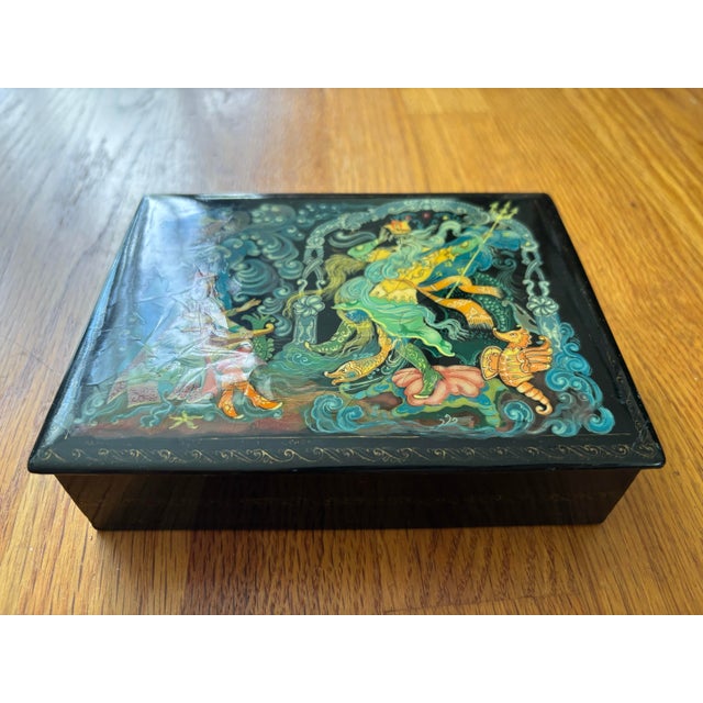 An exquisite, vintage Russian lacquer miniature box beautifully hand-painted on papier-mâché. The highly detailed lid...