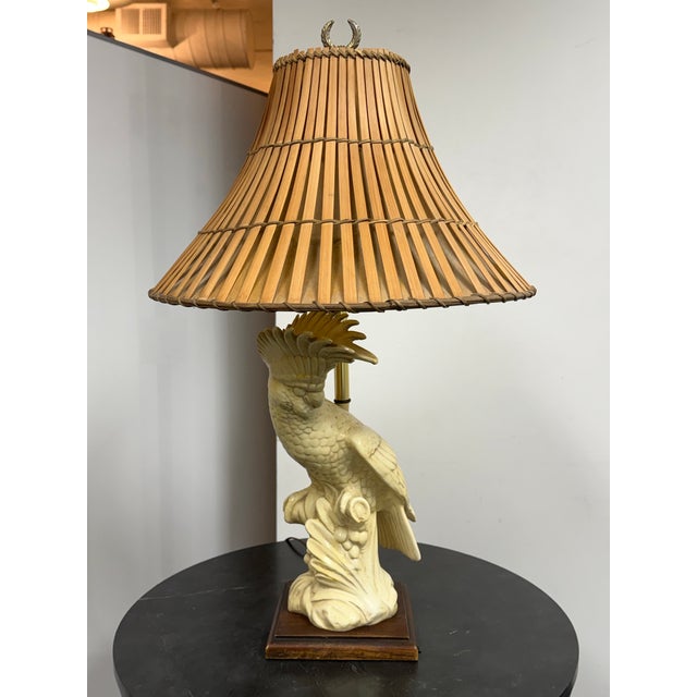 Design Plus Gallery presents a Vintage Cockatoo Table Lamp. The sculptural ceramic body depicts a cockatoo perched on a...