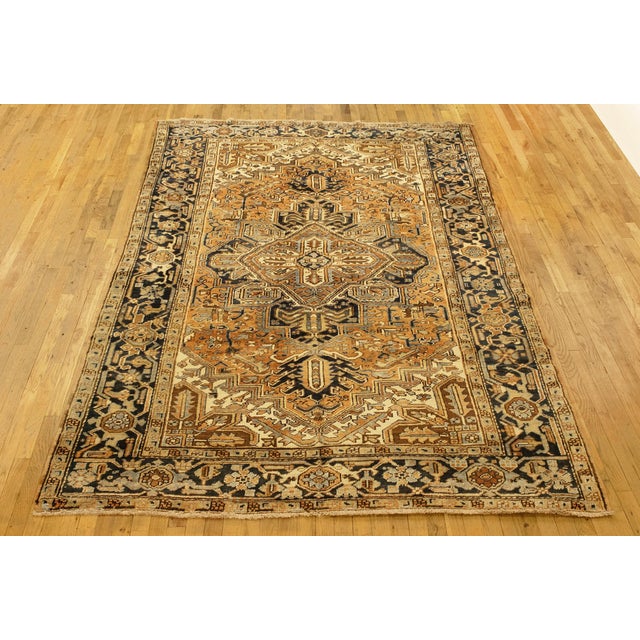 Vintage Persian Heriz Oriental rug, Room size A vintage Persian Heriz oriental rug, size 9'8" x 6'4", circa 1930. This...