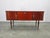 Refined italian mid century sideboard from the 1950s, executed in richly figured wood veneer with an elegant high gloss...
