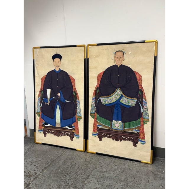 Design Plus Gallery presents a Pair of Antique Chinese Qing Dynasty Ancestor Portraits. These traditional hand-painted...