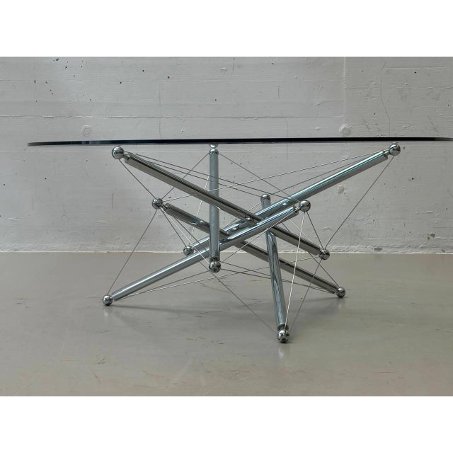 The extraordinary Tensegrity 713 coffee table, designed by Theodore Waddell for Cassina in 1973, is based on the...