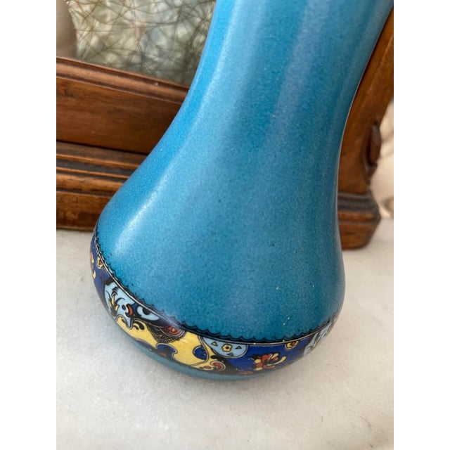 Beautiful moody European vase in a saturated medium tone blue. Saturated coloring with a beautiful floral band. Stamped on...