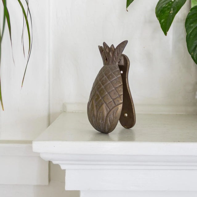 A vintage brass pineapple door knocker for a cheerful greeting! Substantial in weight. The brass strike plate is attached;...