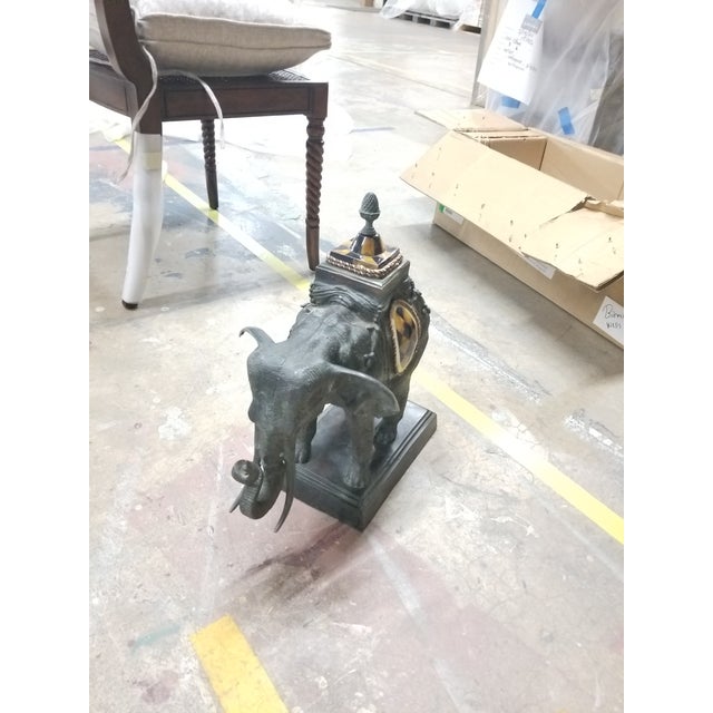 Elegant vintage bronze elephant sculpture in the manner of Maitland-Smith, featuring rich patina detailing and classic...