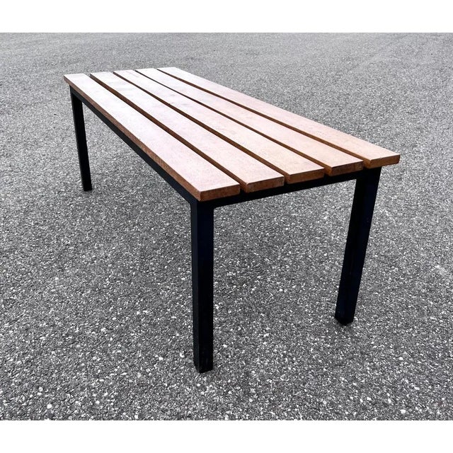 Large bench of the 1950s with oak slats and steel base with square section. Could be used as a coffee table.