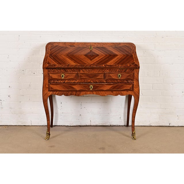 A gorgeous antique French Regency Louis XVI style bureau de pente drop front ladies writing desk In the manner of Maison...
