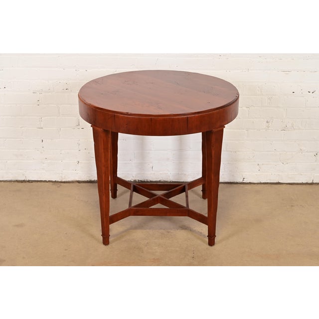 A gorgeous Federal or Regency style carved cherry wood occasional side table or tea table By Baker Furniture, "Milling...