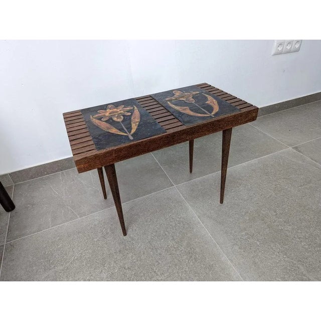 Fantastic Mid Century slatted wood side table in the style of American designer Mel Smilow, mid-20th century. Made of...