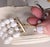 Crica 1950s goldtone 4-strand faux-baroque pearl collar necklace with hook clasp. Marked crown "TRIFARI" on the hook....
