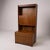 A beautifully proportioned mid-century teak highboard drinks cabinet by William Lawrence, combining elegant British...