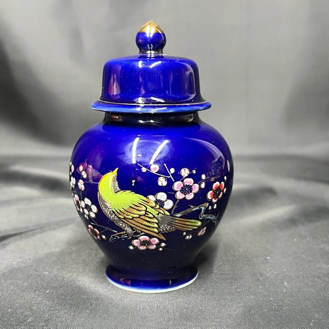 Charming petite vintage Chinese ginger jar (temple jar or urn) in the timeless blue-and-white tradition, featuring a rich...