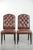 This set of 6 elegant cognac-colored cowhide leather Chesterfield dining chairs is in the English style. A dining chair is...