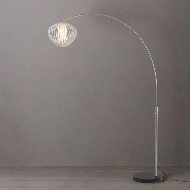 Featuring a Sphere White Satin shade, the Float Arc Lamp is an elegant arc lamp with a Satin Nickel Steel body and a Steel...