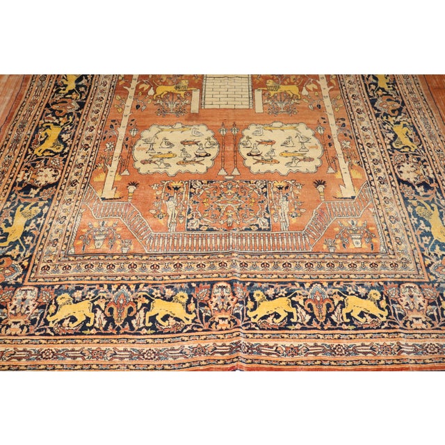 A remarkable late 19th-century pictorial tree of life Tabriz rug woven by Hadji Jalili workshop in the city of Tabriz....