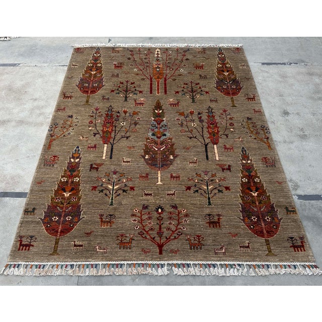 Description: Celebrate heritage and artistry with this Vintage Persian Gabbeh Wool Tree of Life Rug, a handwoven piece...
