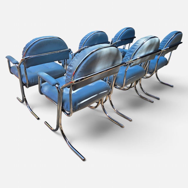 Jerry Johnson for Cal-Style Furniture Dinning Chairs These late 1970s modern armchairs feature polished tubular chrome...