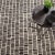 The rhythmical design of this luxurious, plush wool rug conjures surfaces of ancient hand-laid rock walls. The contrast...