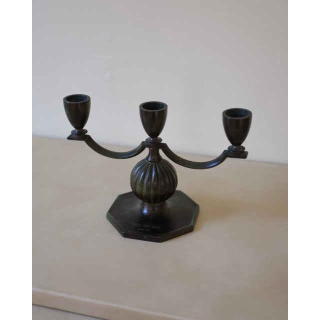 Small bronze candleholder by GAB, Sweden, with space for 3 candles. Beautiful curvy shape with a nice green shade. Age...