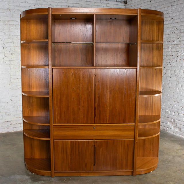 Magnificent vintage Scandinavian Modern teak lighted bookcase, display or entertainment cabinet composed of 3 separate...