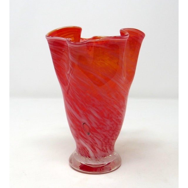 A vintage hand-blown orange and white glass handkerchief vase. The vase stands only 5 1/2 inches tall, and weighs about 1...