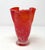 A vintage hand-blown orange and white glass handkerchief vase. The vase stands only 5 1/2 inches tall, and weighs about 1...