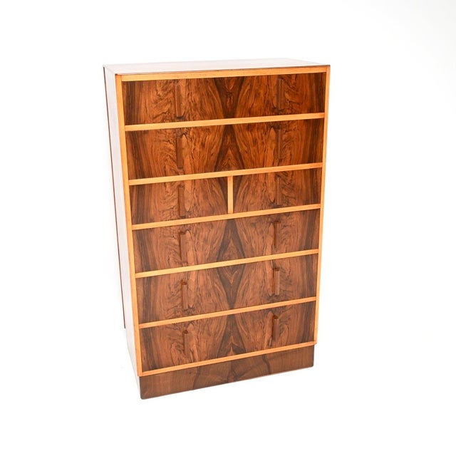 A stunning Art Deco figured walnut chest of drawers, this was made in England and dates from the 1930’s. It is a large and...