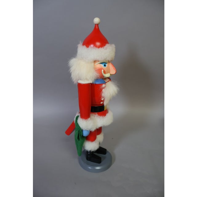 A charming vintage Erzgebirge wooden Santa Claus nutcracker, made in the former German Democratic Republic (East Germany)...