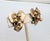 1950s goldtone textured leaf with goldtone ball beads grape cluster clip earrings. Marked "NAPIER PAT. PEND." on the...