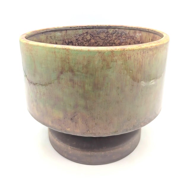 Offered is a mid 20th Century, circa. 1960s or 1970s lava drip-glazed pedestal or footed planter made by Haeger Potteries....