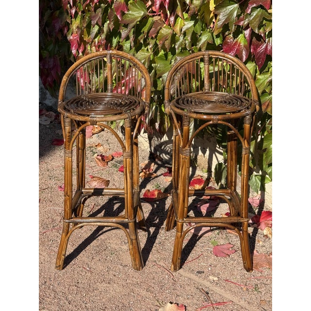 Set of 2 rattan bar stools from the 1960s. Very fine French work.