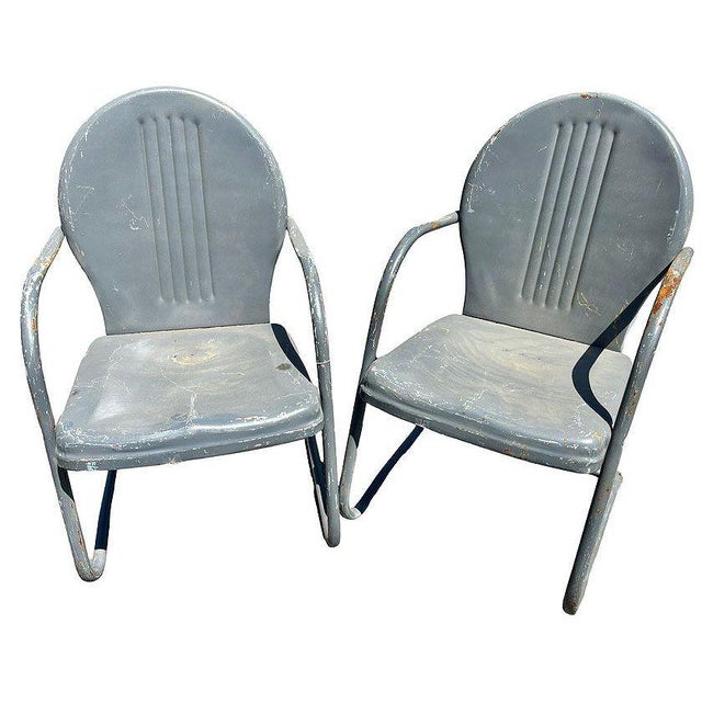 Steel Mid-century Springer Outdoor grey enamel Lounge Chair Set of Two. Each chair features a round tubular U-shaped base...