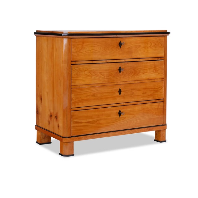 Chest of drawers Biedermeier, circa 1820, Germany, cherry wood, three drawers with a decorative drawer, beveled sides,...
