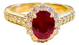Oval 1.5 Carat Treated Ruby and 1.20 Carat Diamond 14 Karat Yellow Gold Ring