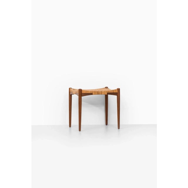 - Stool in the style of Aksel Bender Madsen & Ejnar Larsen - Produced in Denmark, 1950s - Teak frame and woven cane seat