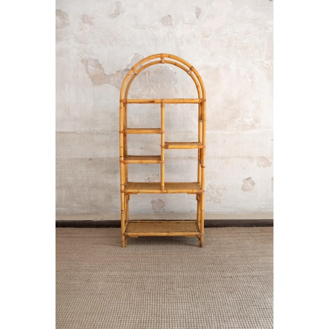 Pair Of Arched Bamboo Bookcases with Woven Rush Fabric – 1970s Pair of bookcases with an asymmetrical structure crafted in...