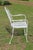 Wrought Iron Patio Set—Four Armchairs and a Table With a Glass Top For Sale - Image 6 of 18