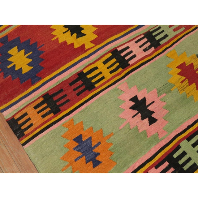 Turkish Kilim from the mid-20th century with an array of bright colors. Measures: 3'4" x 4'3".