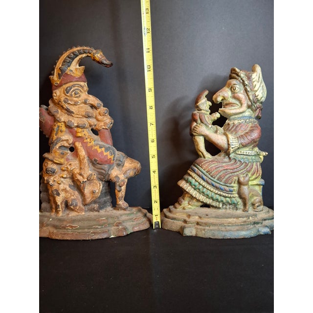 Offered is a highly decorative and characterful matching pair of antique early 20th-century cast iron figural doorstops...