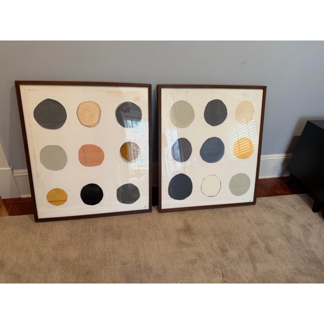 Set of two contemporary abstract prints originally retailed by Mitchell Gold + Bob Williams. Each piece features a 3x3...