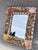 Vintage rectangular seashell rimmed wall mirror. Wire attached in the back for hanging. Very good condition. It measures...