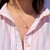 About This Charm: A delightful 14K yellow gold martini glass charm, complete with a tiny straw and lemon slice—a charming...