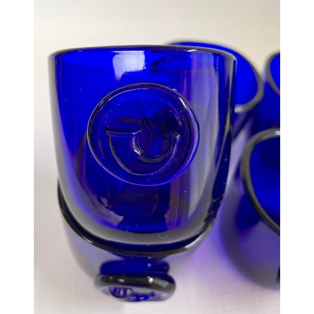 Festive set of 5 “Viking” cups designed by Ole Winther for Holmegaard. Cups are cobalt flue and have Viking horn seal....