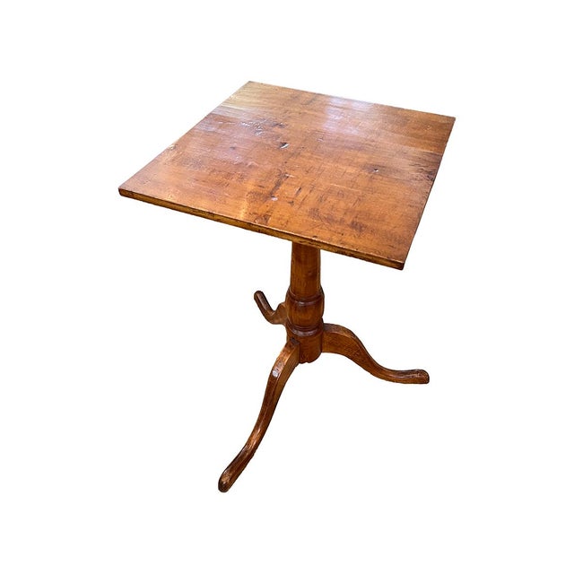 This petite table is level and sturdy. It is made of walnut and is very lightweight.
