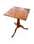 This petite table is level and sturdy. It is made of walnut and is very lightweight.