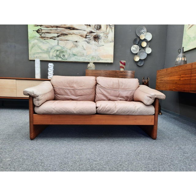 High-quality two-seater sofa by A. Mikael Laursen. Solid teak frame with original leather cushions. The sofa was...