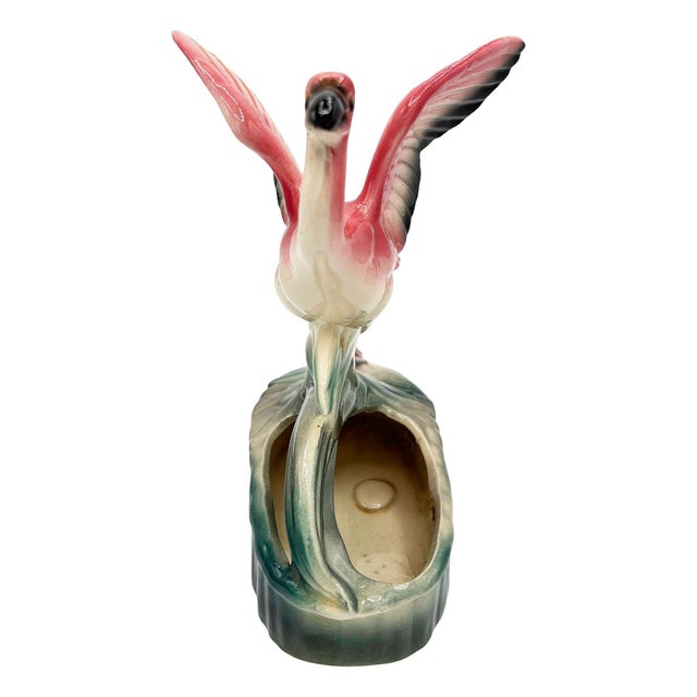 Mid-century pink and green ceramic open-wing flamingo tabletop California art pottery planter. The planter features a...